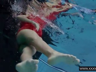 Captivating Brunette Anna in Red Dress Swimming